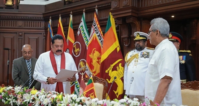 Mahida Rajapakshya being sworn in as the PM